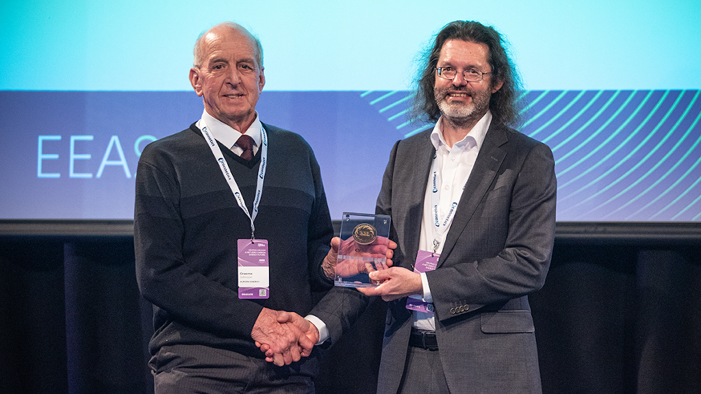 Graeme Johnson receving his Life Membership Award at the 2022 EEA Conference